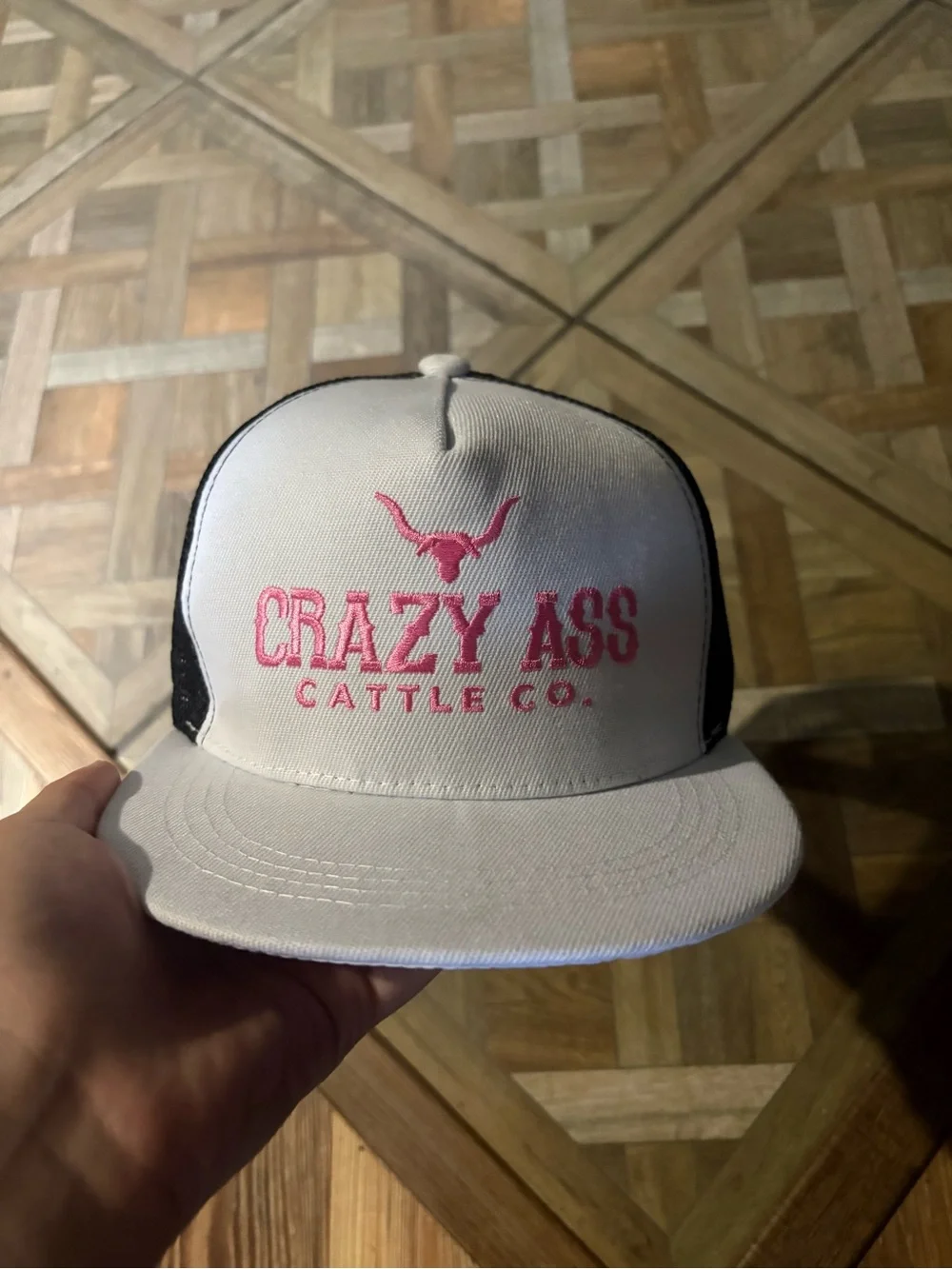 Crazy Ass Cattle Co. white & black hat with pink logo